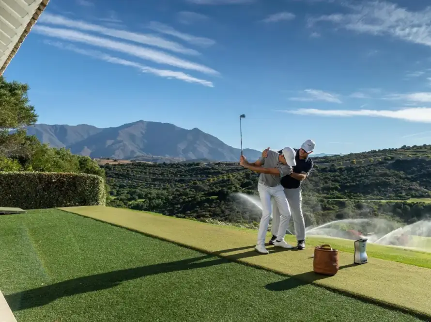 Golf coach with student on a golf course in Spain