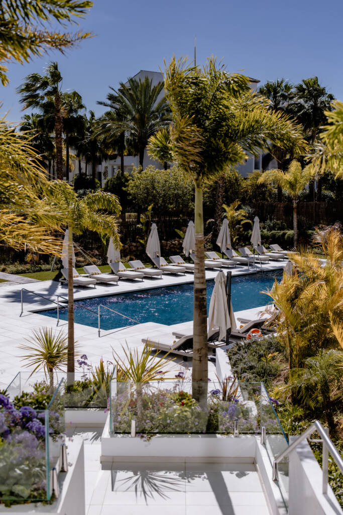 Pool and tropical garden at THE FLAG hotel in Estepona